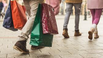 Holiday shoppers holding bags